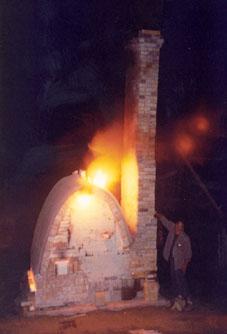 Wood Firing: Flames shooting out of the Blow Hole located at the top of the chamber.