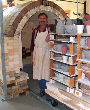 Glazed pots are loaded into a Gas Fired Car Kiln prior to the gloss firing.